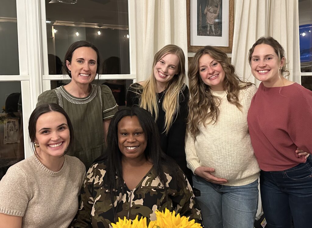 Six women from a Primary Care Community pose together, Christ Covenant's answer to the question, "How can I get my church involved in child welfare?"