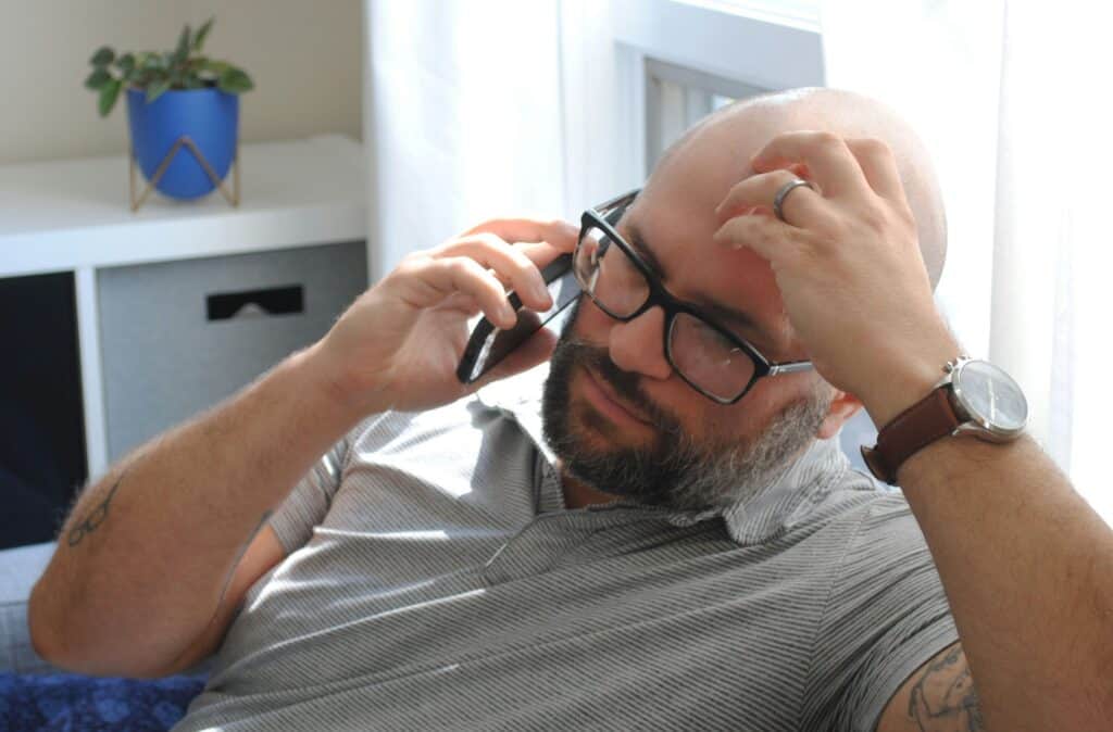 Reporting suspected child abuse can feel uncomfortable, like this man does as he makes the phone call, but it's important to make sure kids are safe.