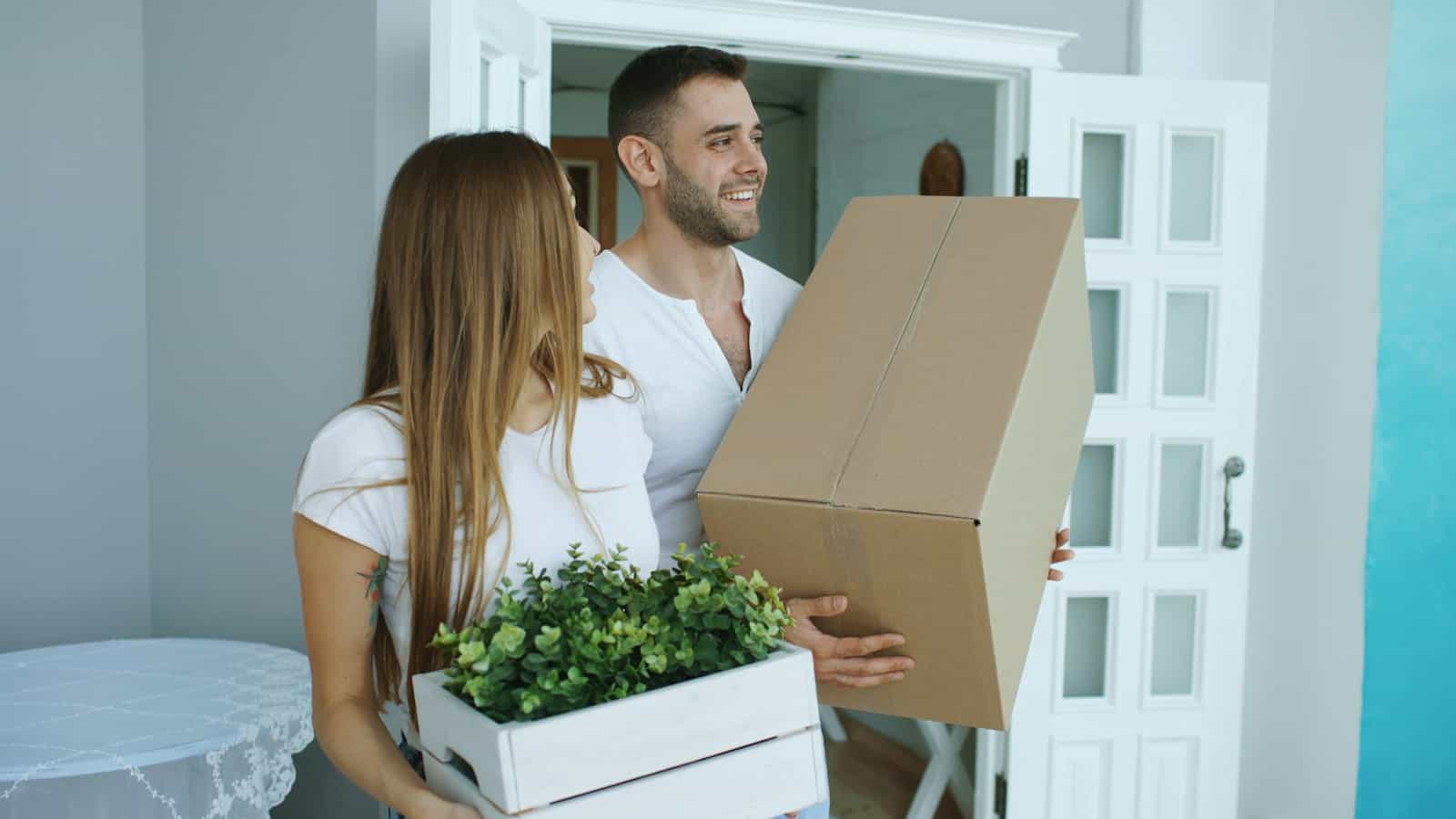 Prevention works when communities connect what they already have, like this couple carrying boxes through a front door.