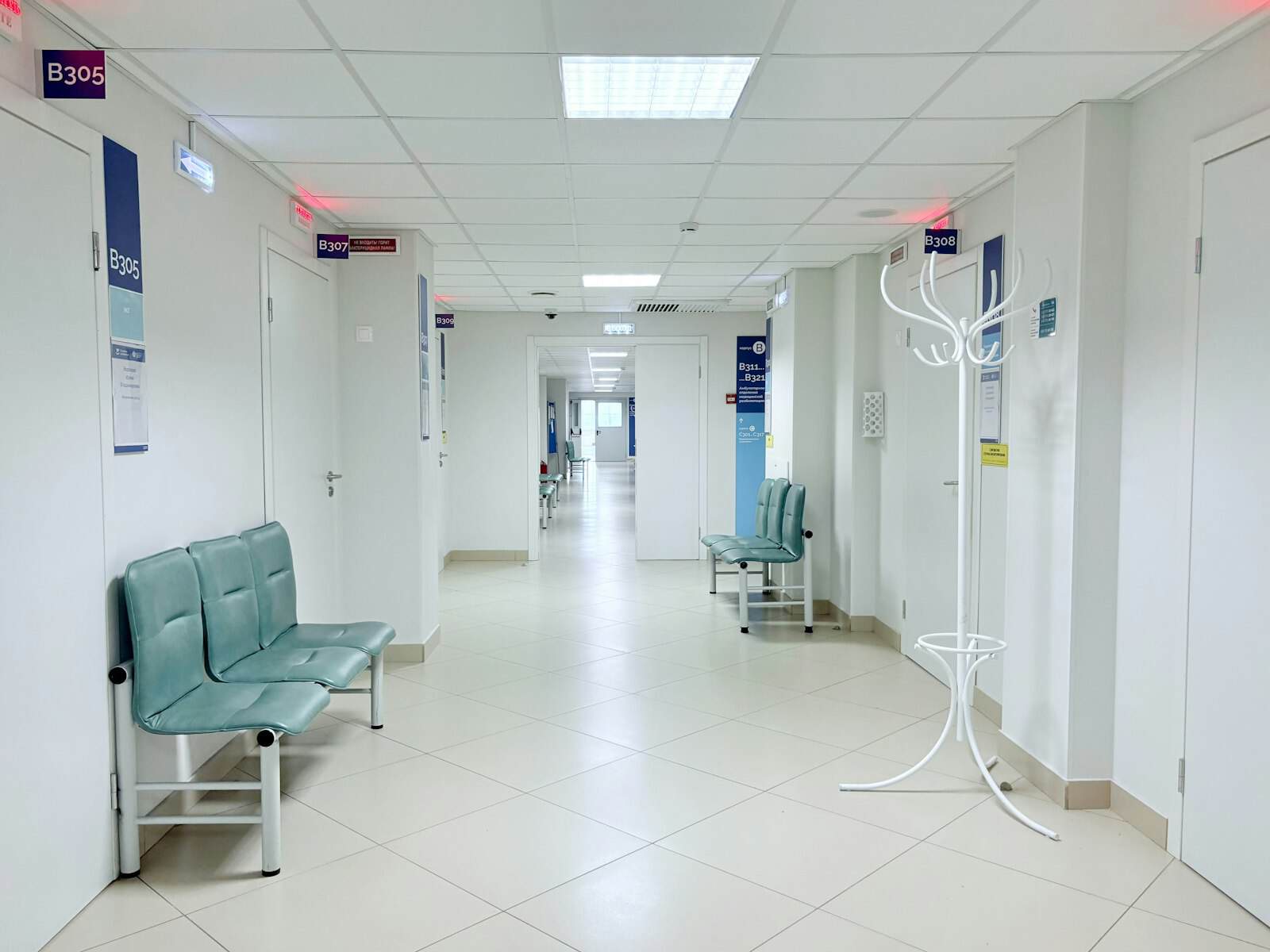 The cost of child maltreatment surfaces decades later in health care, like this empty hospital corridor with a row of waiting chairs.